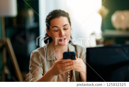 Woman is doing online purchases 125832325