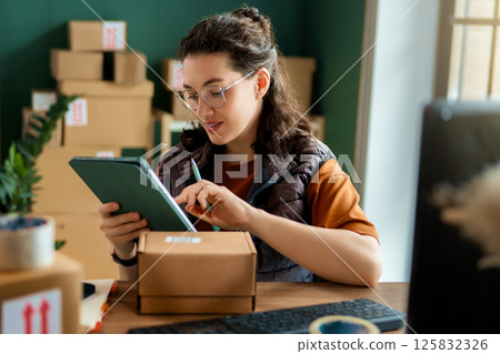 Woman working in a warehouse 125832326