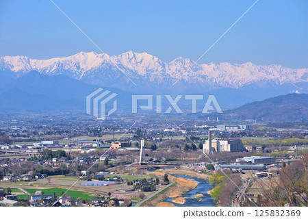 View from Matsumoto City Shiroyama Park: Snow-covered Northern Alps and Matsumoto Basin 125832369