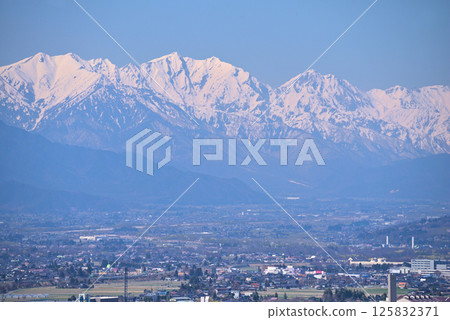 View from Matsumoto City Shiroyama Park: Snow-covered Northern Alps and Matsumoto Basin 125832371