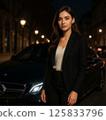 Young businesswoman standing in front of a car 125833796