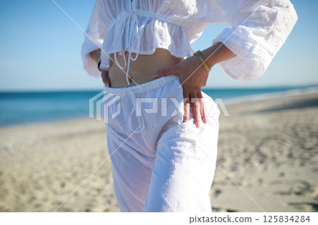 Girl At The Beach With White Dress Gets Ready For Summer Girl At The Beach With White Dress Gets Ready For Summer 125834284