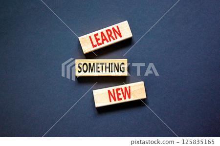 Learn something new symbol. Concept words Learn something new on beautiful block. Beautiful black table black background. Business motivational lifestyle learn something new concept Copy space 125835165