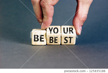 Motivational be your best symbol. Concept words Be your best on beautiful wooden block. Beautiful grey background Businessman hand. Business motivational be your best concept. Copy space. 125835186
