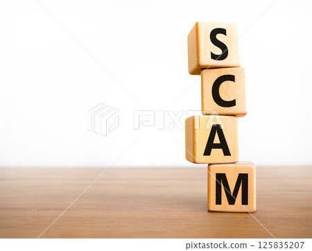 Scam symbol. Concept word Scam on beautiful wooden blocks. Beautiful wooden table white background. Business, lifestyle, support and scam concept. Copy space. Scam symbol. Concept word Scam on beautiful wooden blocks. Beautiful wooden table white background. Business, lifestyle, support and scam concept. Copy space. 125835207