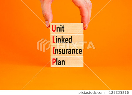 ULIP Unit Linked Insurance Plan symbol. Concept word ULIP Unit Linked Insurance Plan on beautiful blocks. Beautiful orange background. Business ULIP Unit Linked Insurance Plan concept. Copy space. 125835216