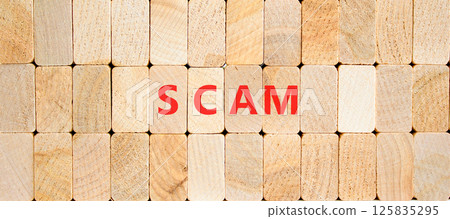Scam symbol. Concept word Scam on beautiful wooden blocks. Beautiful wooden blocks background. Business, lifestyle, support and scam concept. Copy space. Scam symbol. Concept word Scam on beautiful wooden blocks. Beautiful wooden blocks background. Business, lifestyle, support and scam concept. Copy space. 125835295