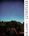 Campsite with a tent and a starry sky 125835338