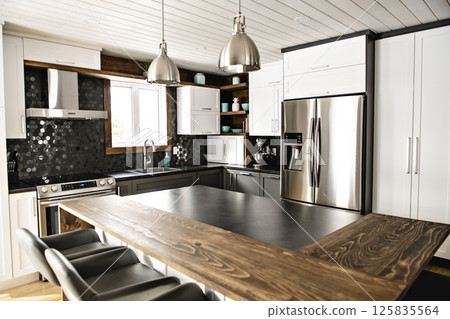 Modern gray kitchen in a beautiful house 125835564