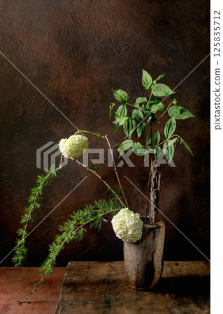 Rustic Floral Arrangement With White Hydrangeas Rustic Floral Arrangement With White Hydrangeas 125835712