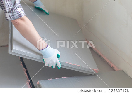 Laying insulation boards for effective thermal protection. 125837178