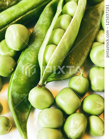 Harvest organic vegetables green peas. Harvest organic vegetables green peas. 125837281