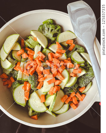 Carrot and zucchini salad in a frying pan 125837335