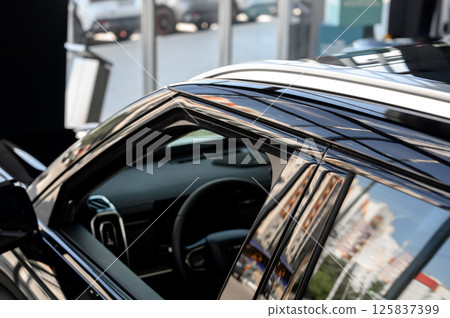 Roof of a new black modern car Roof of a new black modern car 125837399