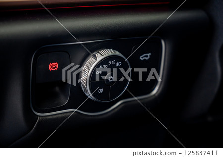 close-up of the headlight setting buttons. 125837411
