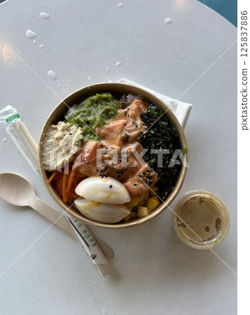 vertical photo paper container food delivery Delicious salmon and avocado poke bowl garnished with sesame seeds and seaweed, stylized food photography, vibrant color composition vertical photo paper container food delivery Delicious salmon and avocado poke bowl garnished with sesame seeds and seaweed, stylized food photography, vibrant color composition 125837886