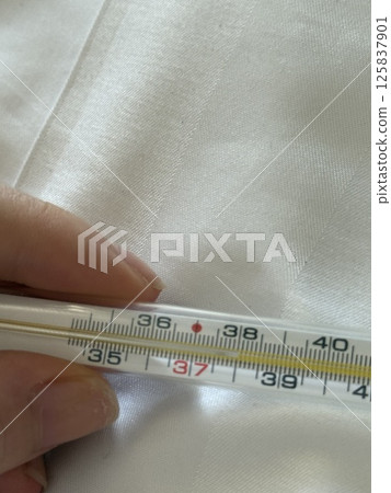 vertical photo Thermometer hand fabric the temperature on the thermometer is 38 Mercury-in-glass thermometer with temperature mark 38 isolated on white background flat lay png vertical photo Thermometer hand fabric the temperature on the thermometer is 38 Mercury-in-glass thermometer with temperature mark 38 isolated on white background flat lay png 125837901