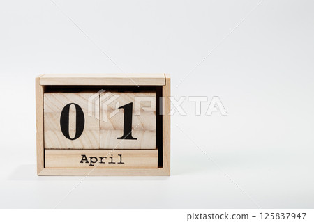 Wooden calendar April 01 on a white background 125837947