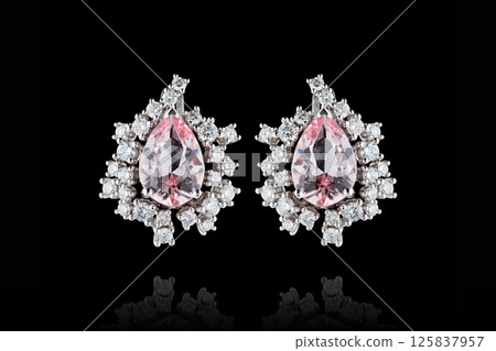 earrings silver, gold with stone morganite, diamonds on black background earrings silver, gold with stone morganite, diamonds on black background 125837957