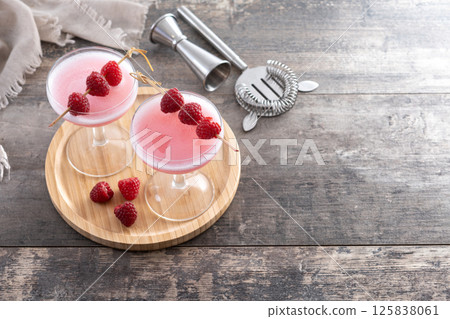 Elegant French Martini Cocktail on wooden table Elegant French Martini Cocktail on wooden table 125838061