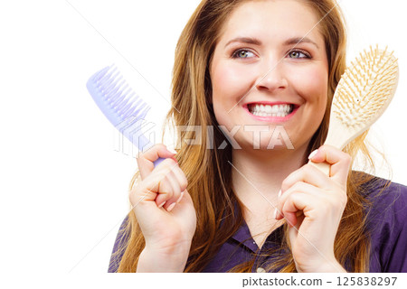 Girl long hair with comb brush Girl long hair with comb brush 125838297