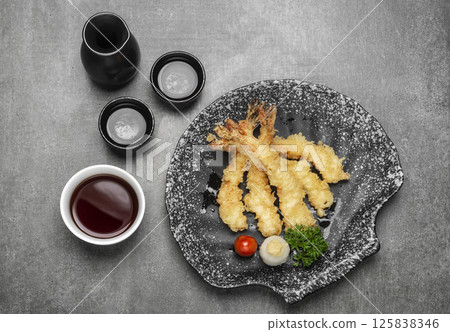 Crispy Japanese Ebiten Shrimp Tempura on grey background Crispy Japanese Ebiten Shrimp Tempura on grey background 125838346