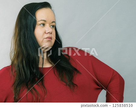 Unhappy sad big woman Unhappy sad big woman 125838510