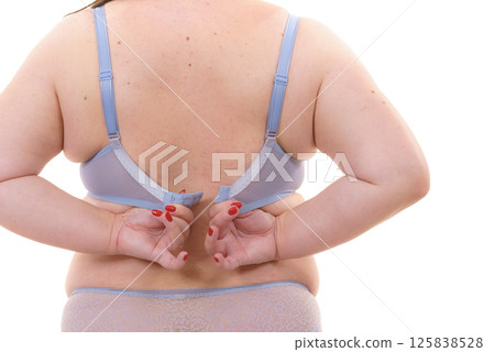 Woman wearing bra. Back view Woman wearing bra. Back view 125838528