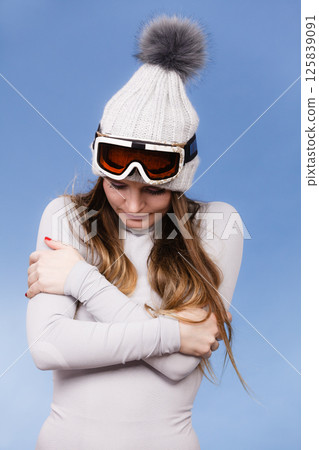 woman in thermal underwear ski googles 125839091