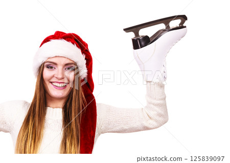 woman santa claus with ice skates woman santa claus with ice skates 125839097