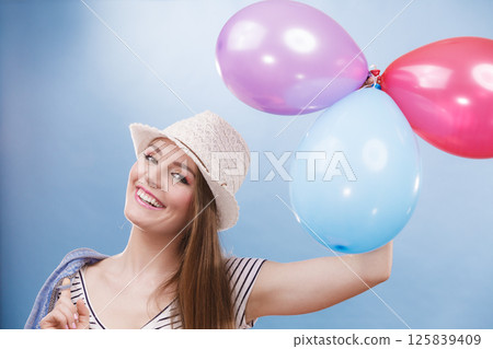 Woman summer joyful girl with colorful balloons 125839409