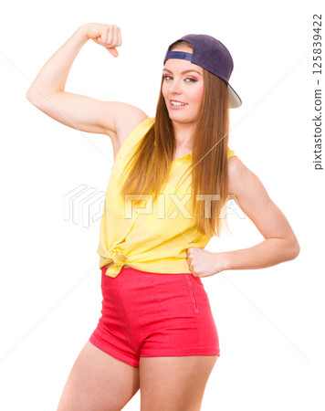 Woman casual style showing off muscles biceps 125839422