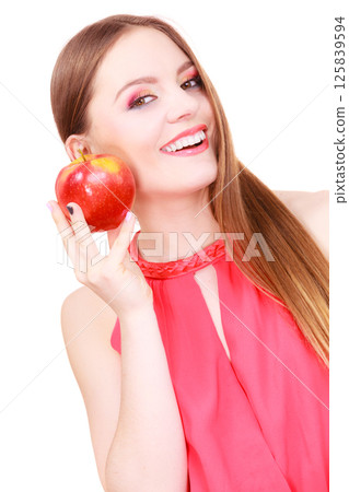 Woman charming girl colorful makeup holds apple fruit 125839594