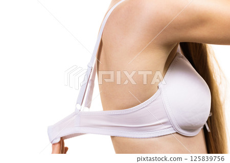 Woman wearing too big bra Woman wearing too big bra 125839756