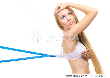 Woman wearing too big bra, loose band Woman wearing too big bra, loose band 125839760