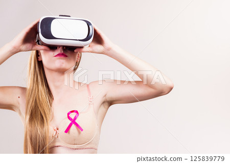 Girl in bra pink cancer ribbon and vr box Girl in bra pink cancer ribbon and vr box 125839779
