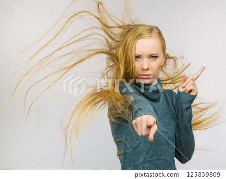 Woman pointing and shaking her finger Woman pointing and shaking her finger 125839809