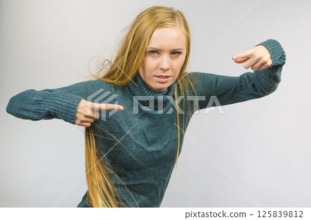 Female pointing with finger Female pointing with finger 125839812