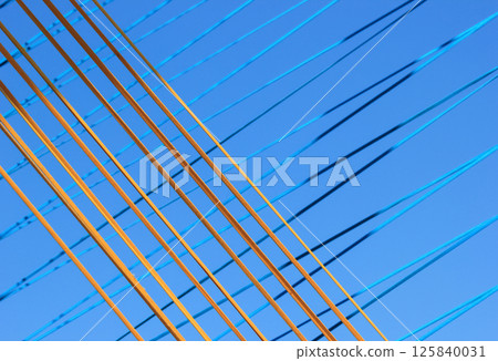 The ropes are brightly colored against the blue sky. The ropes are brightly colored against the blue sky. 125840031