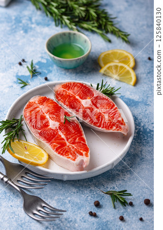 Raw uncooked salmon with rosemary Raw uncooked salmon with rosemary 125840130