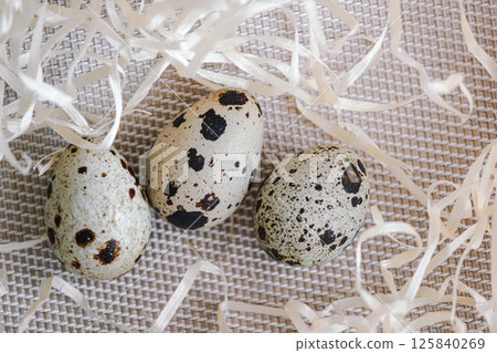 Quail eggs. Background is decorative. 125840269