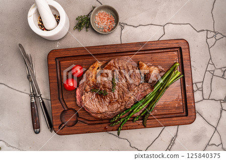 Beef grill steak with green asparagus 125840375