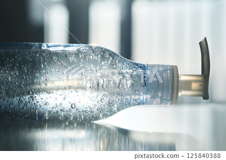 Tube of micellar gel in a ray of sunlight. Tube of micellar gel in a ray of sunlight. 125840388