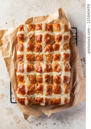 Freshly baked traditional Easter hot cross buns. Delicious Easter breakfast. Top view 125840459