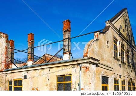 Historic dilapidated building secured against collapse for prospective renovation, Kuldiga, Latvia 125840533
