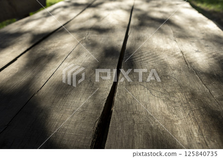 wooden plank table sun and shadows texture 125840735