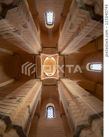 columns of an old building with a dome 125840744