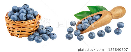 blueberry in wicker basket and wooden scoop isolated on white background blueberry in wicker basket and wooden scoop isolated on white background 125840807