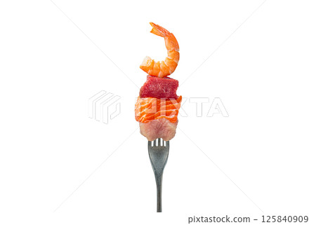 Fork holding pieces of raw salmon, beef, chicken and shrimp representing protein sources isolated on white background Fork holding pieces of raw salmon, beef, chicken and shrimp representing protein sources isolated on white background 125840909