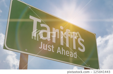 Tariffs Just Ahead Green Road Sign Against Clouds and Sky. Tariffs Just Ahead Green Road Sign Against Clouds and Sky. 125841443